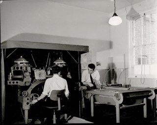 Surveying staff using a plotting instrument 1965